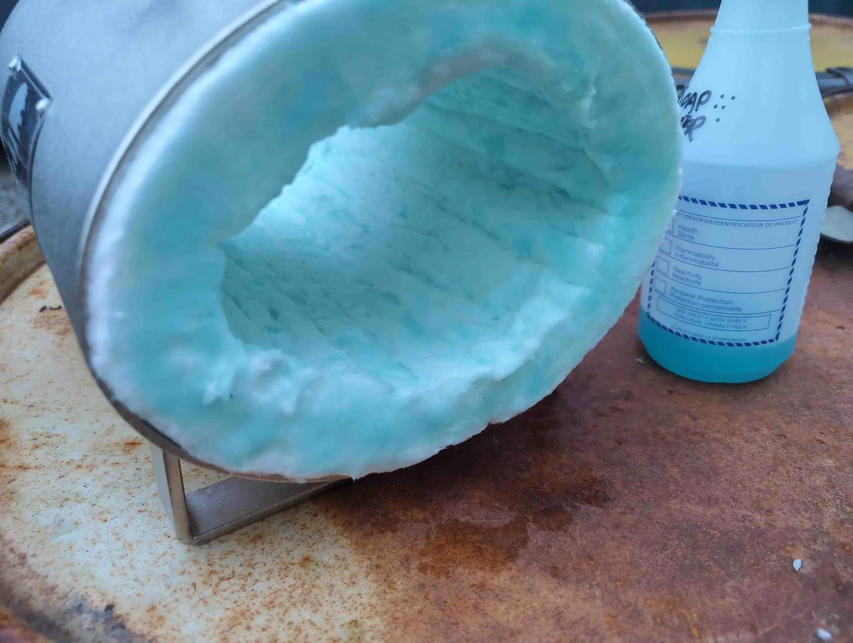 A propane forge with the ceramic wool liner dyed blue by ridgizer spray.